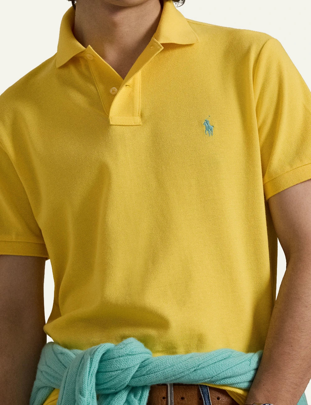 Polo Ralph Lauren short sleeve polo shirt in yellow with embroidered logo, front detail view