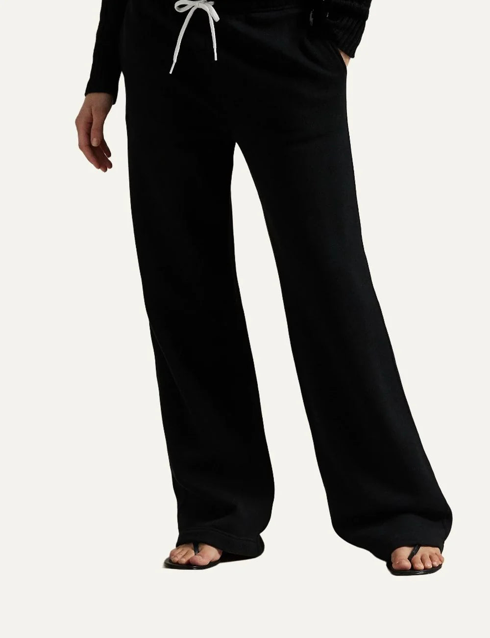 Polo Ralph Lauren women's black wide-leg sweatpants with white drawstring waist, side pockets and embroidered Pony logo model