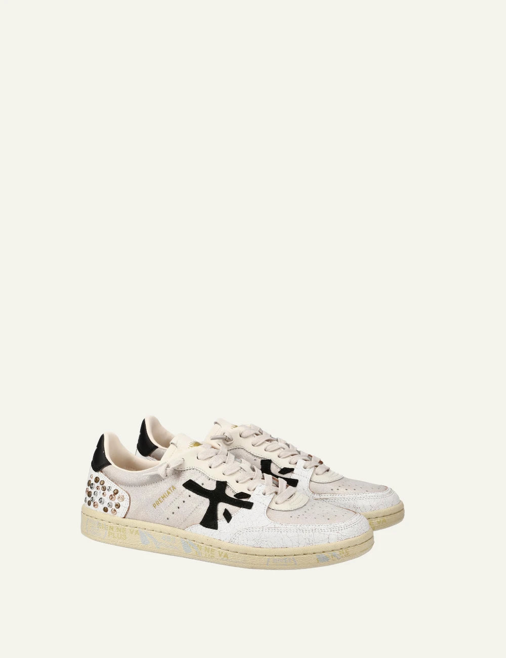 Premiata Istrice sneaker white leather black logo studs heel side angled view