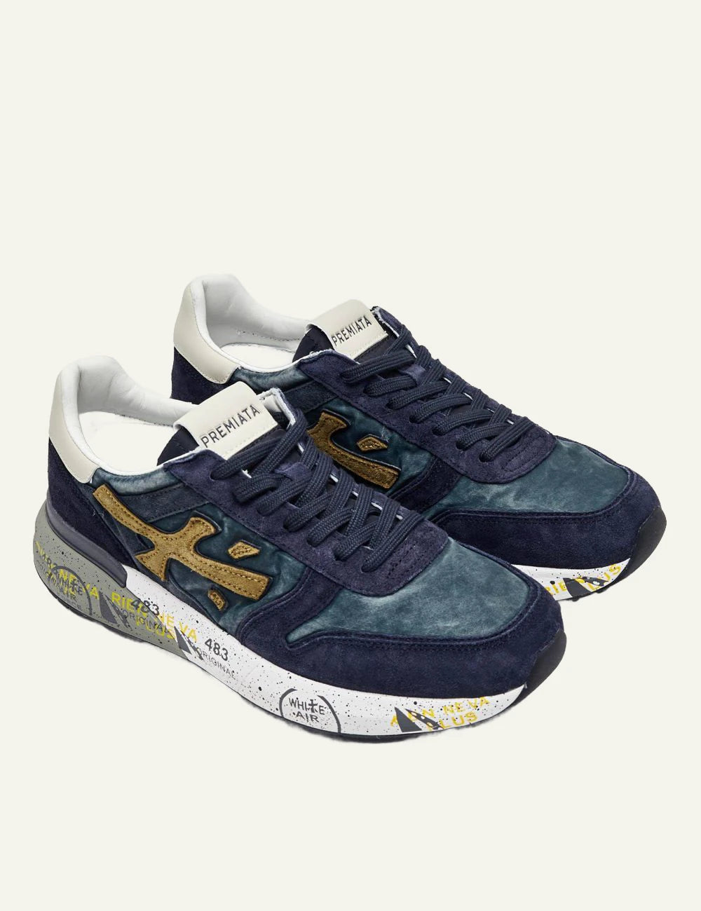 Premiata men's navy blue leather and suede sneakers with gold details angled