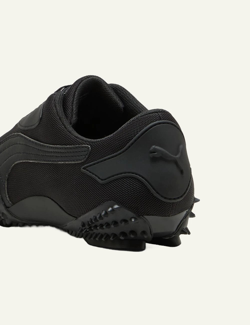Puma Mostro OG black angled back logo view