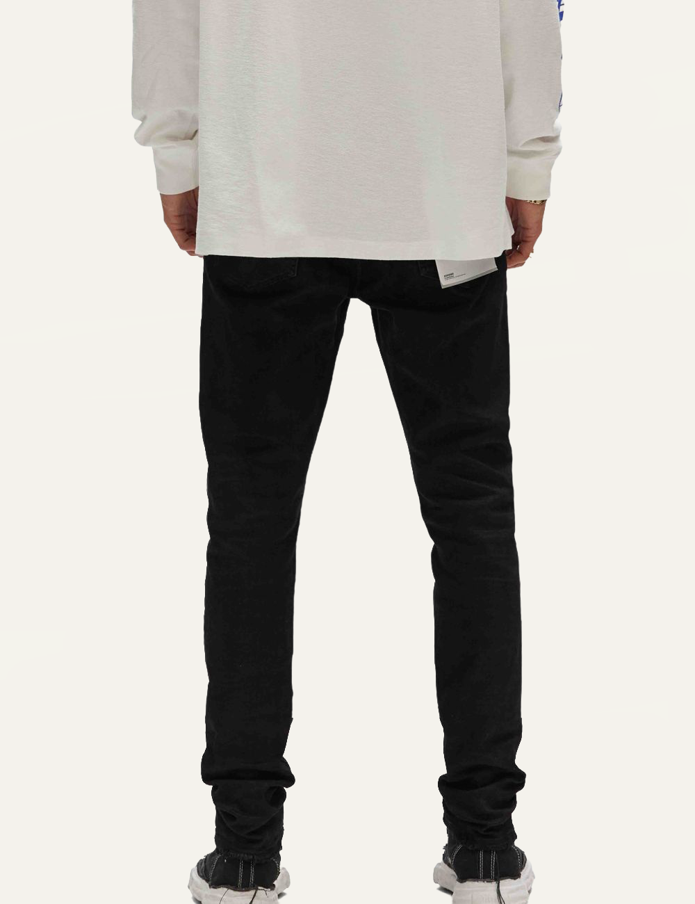 Purple Brand black skinny jeans with resin coated finish back view