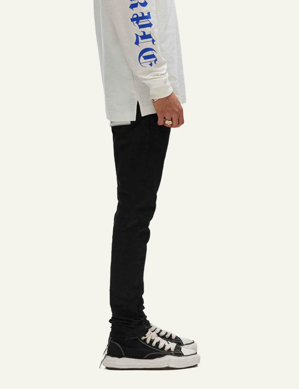 Purple Brand black skinny jeans with resin coated finish side view