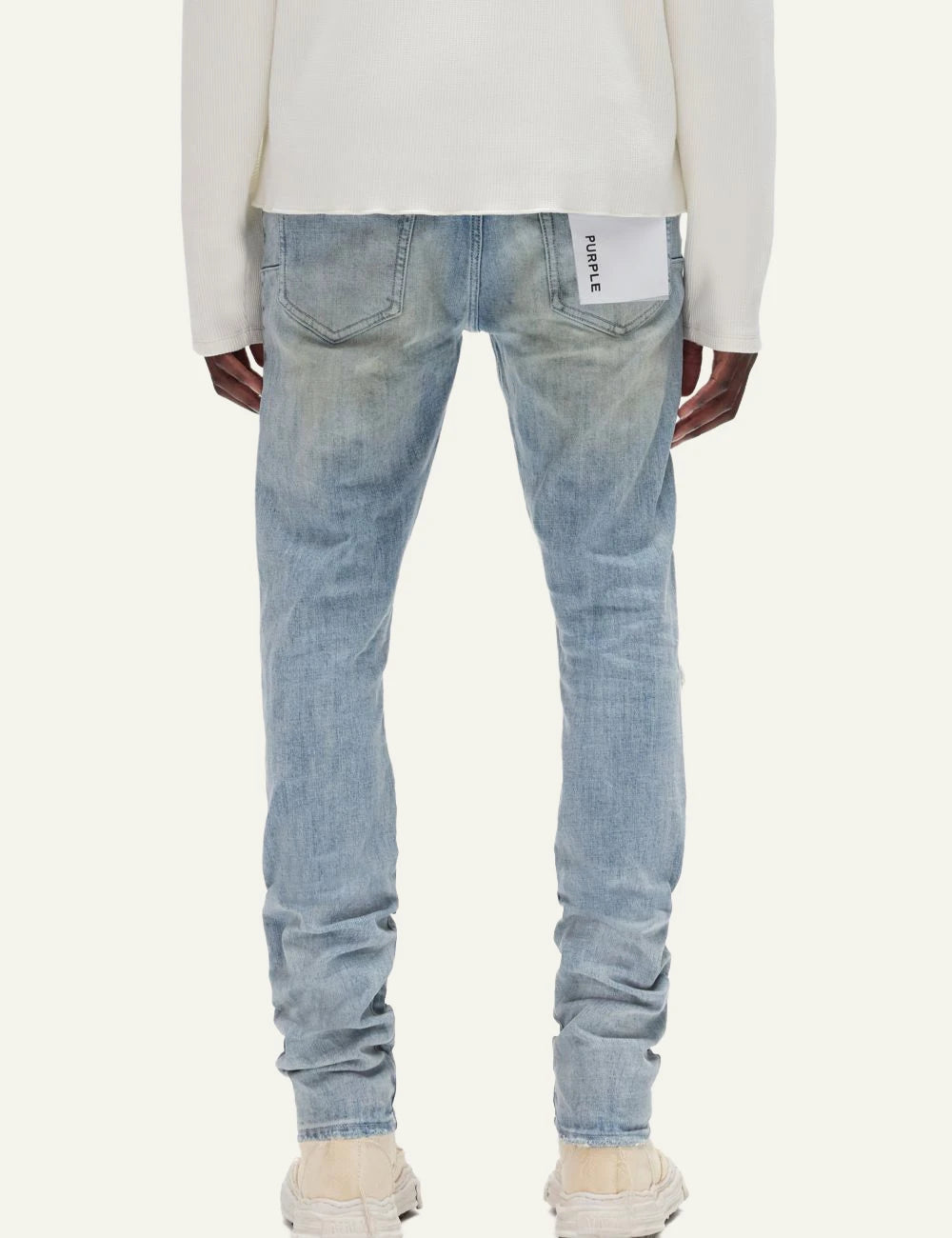 Purple Brand light blue skinny jeans with distressed knee detail back view