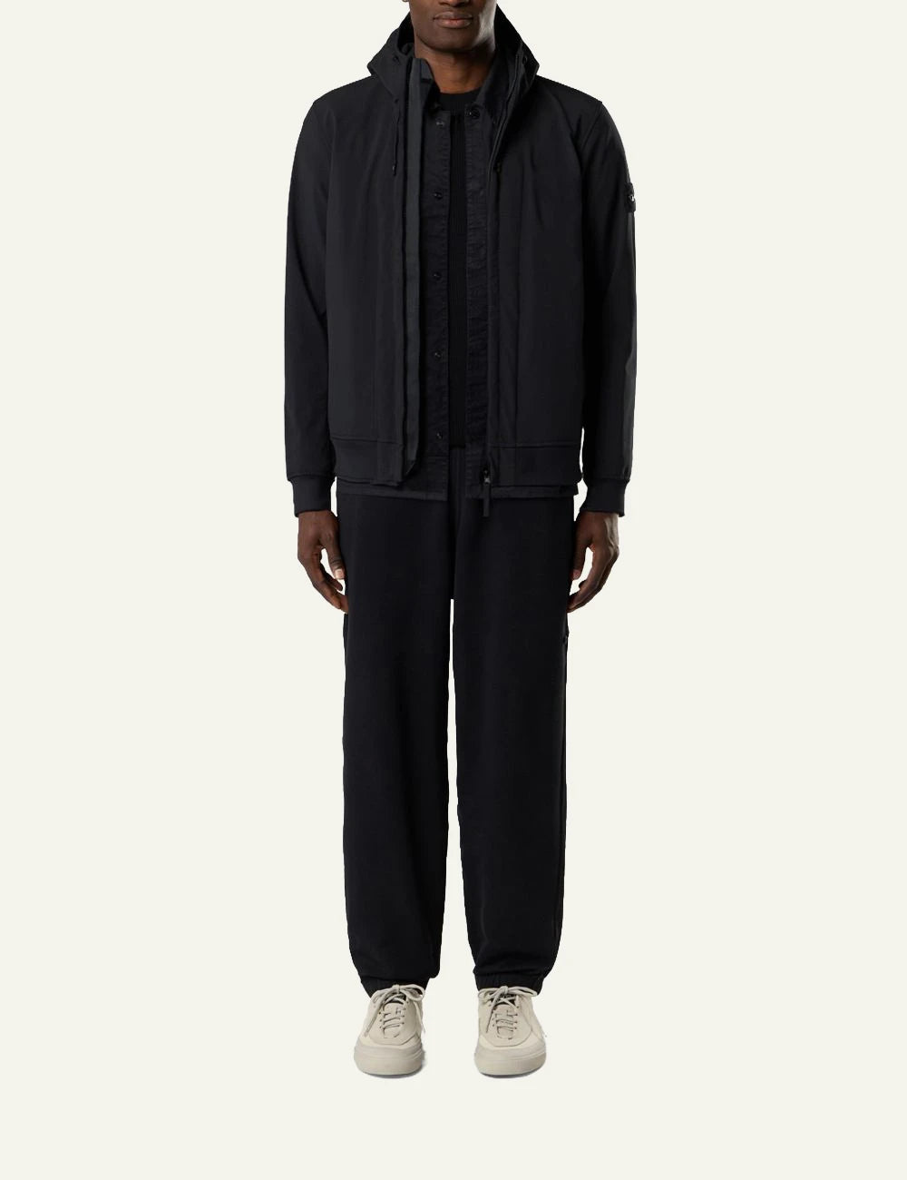Men's Stone Island black technical hooded jacket with Compass patch full body