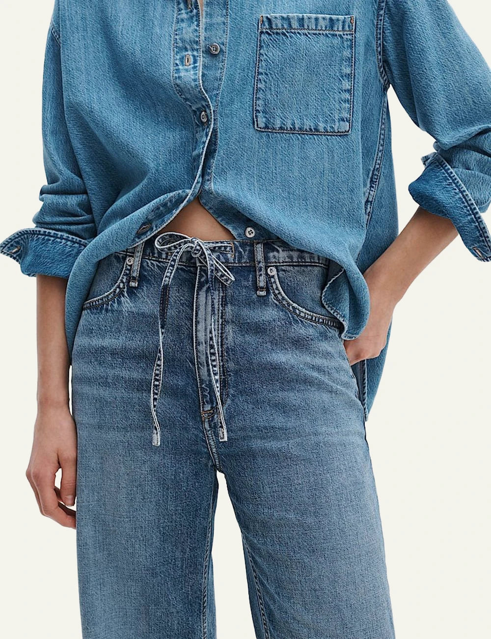 Rag &amp; Bone light blue wide leg denim jeans with self tie waist front detail view