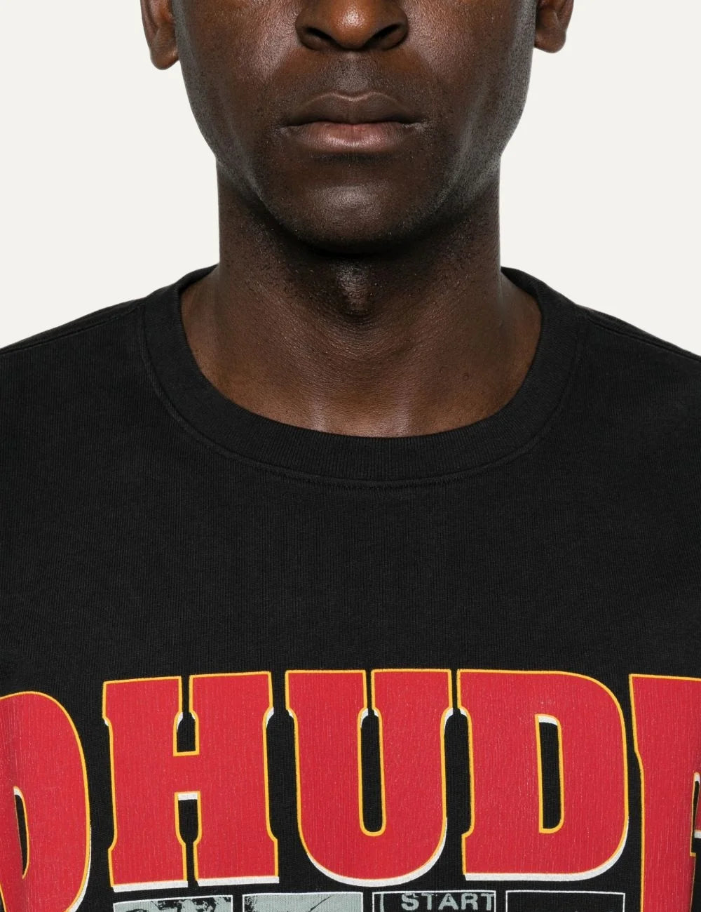 Rhude men's black cotton T-shirt with oversized red and yellow logo, black-and-white graphic panels and The Desert Decides 1991 front print detail