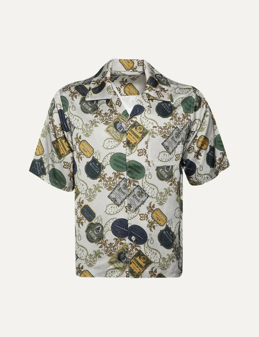 Rhude men's cream white short-sleeve cotton shirt with multicolor vintage label and bandana print, camp collar, button front and chest pocket.
