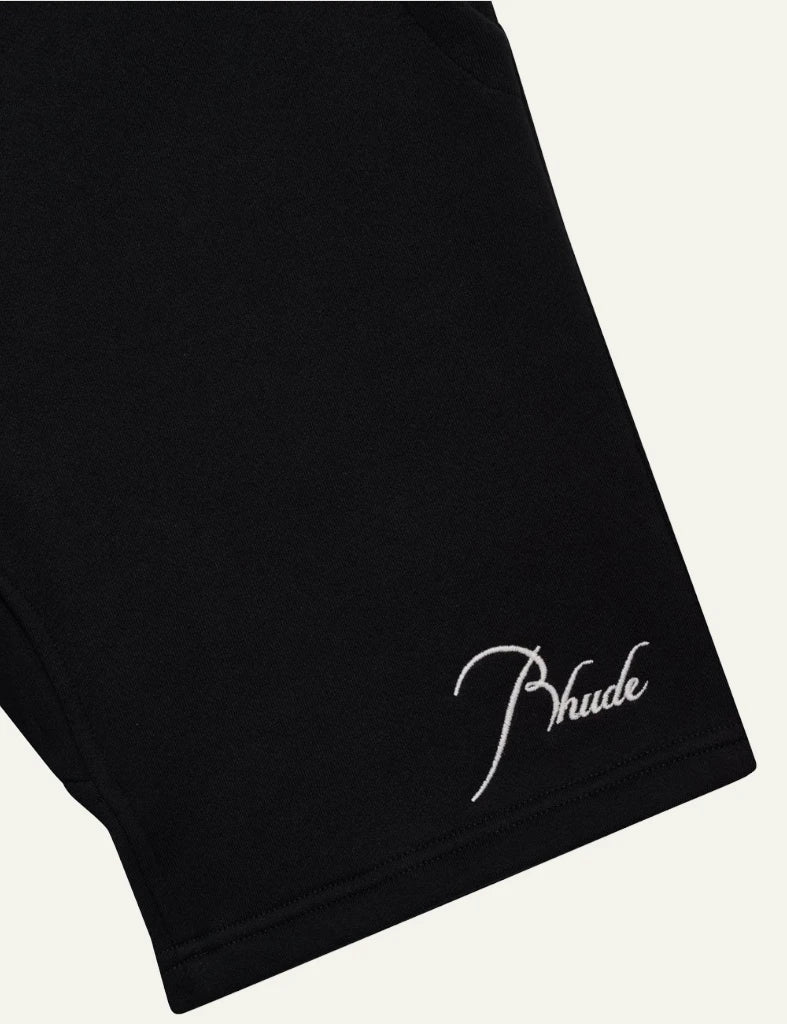 Rhude black sweat shorts mustard drawstrings logo detail view