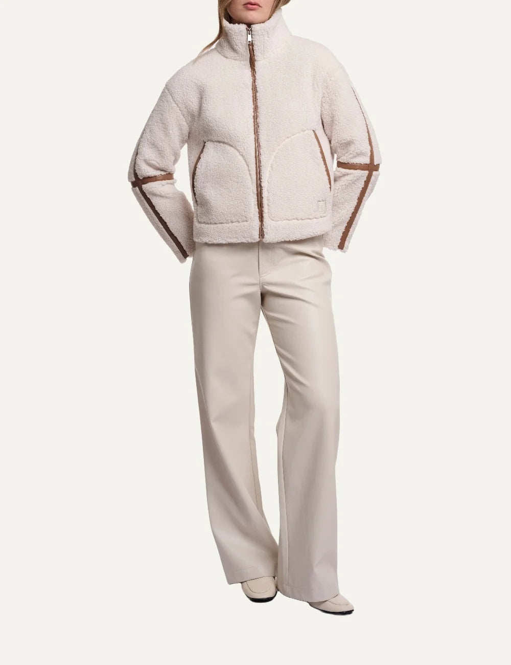 Rino Pelle women's birch cream teddy jacket with a high collar, front zipper, large patch pockets and brown trim front view full look