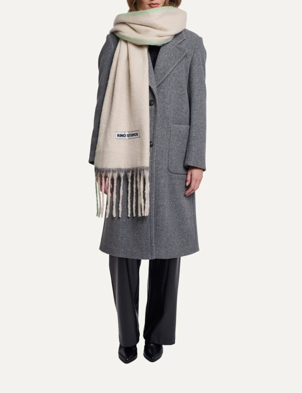 Rino Pelle women's oversized cream scarf with soft lime green accents, long fringes and Rino Studios logo patch full body