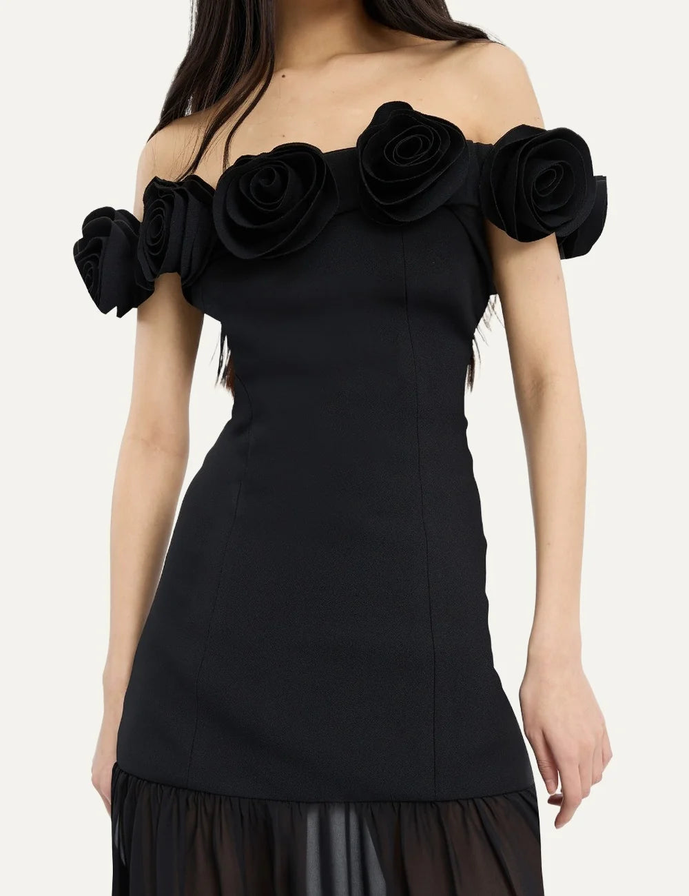 Women's black crepe Maxi dress with an off-shoulder neckline, floral details, fitted bodice and flowing sheer skirt model