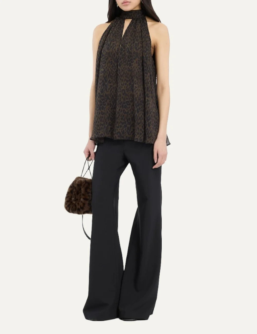 Women's black flared trousers in a recycled polyester blend, with a high waist, front flap pockets and welt back pockets model