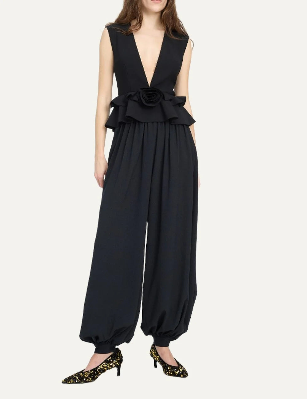 Rotate women black sleeveless V-neck top with structured shoulders, peplum hem and flower detail full body