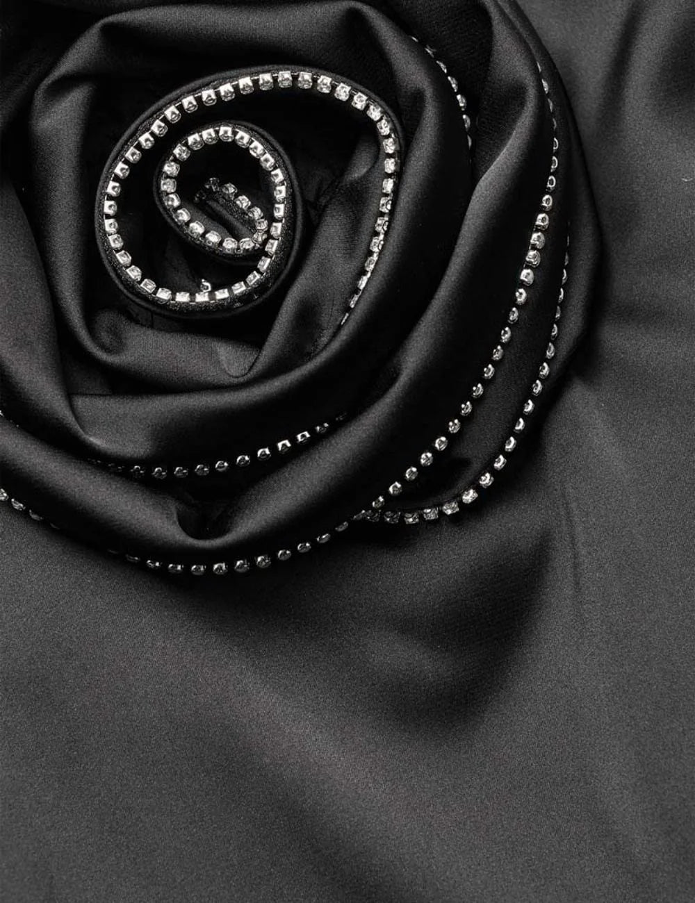 Rotate women black satin midi skirt with draped detail and rhinestone embellished rose appliqué detail