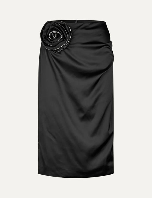 Rotate women black satin midi skirt with draped detail and rhinestone embellished rose appliqué