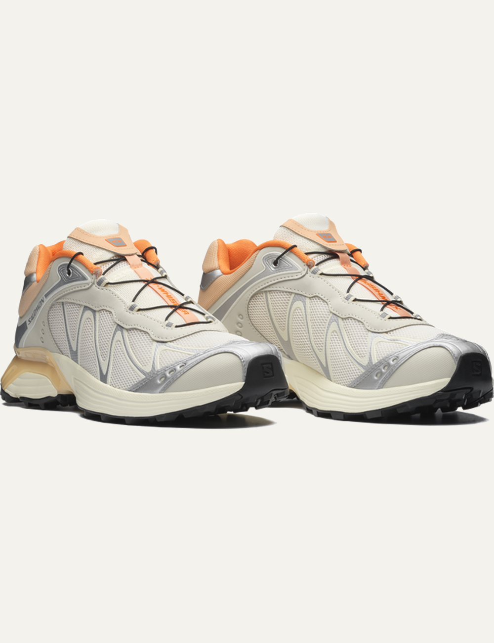 Salomon XT-Whisper off white sneaker with silver and orange details angled view