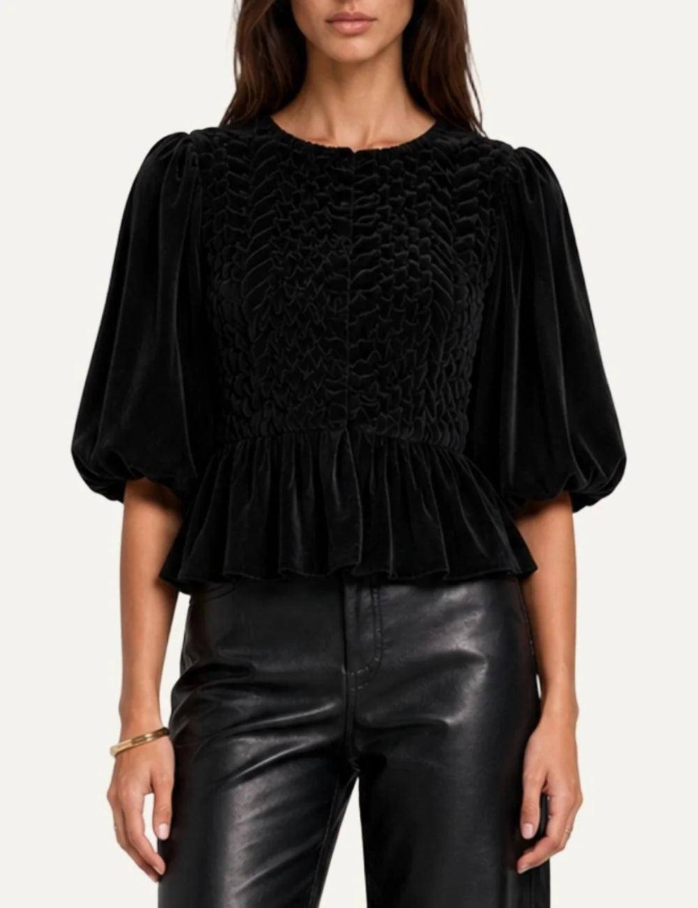 Scarlet Poppies women's Cornelia black cotton velvet peplum top featuring intricate hand-smocked detailing, round neckline, voluminous puff sleeves and flared ruffle hem.