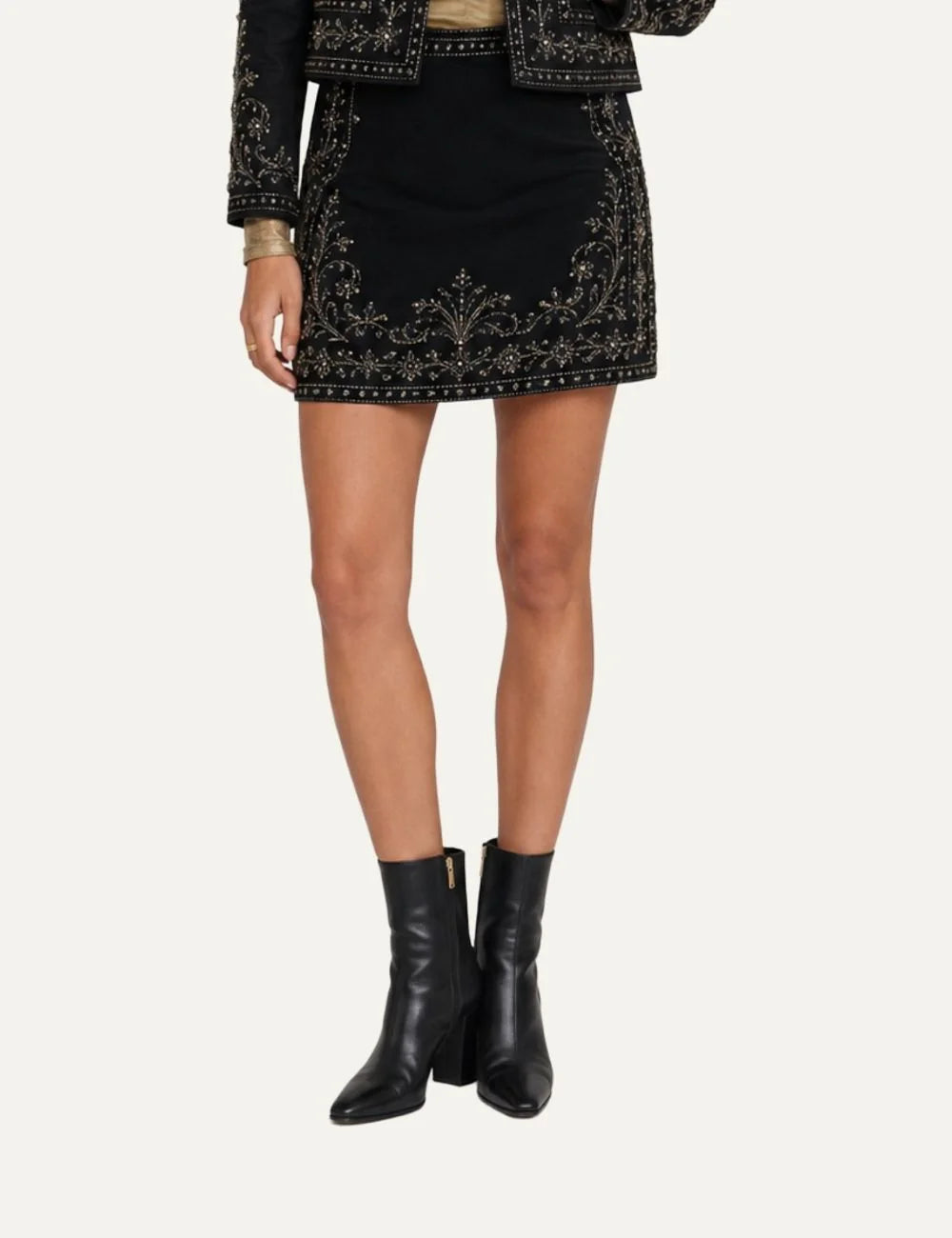 Scarlet Poppies women's black velvet mini skirt with intricate metallic floral embroidery, hand-applied sequins and beadwork, subtle A-line silhouette and side zip closure model