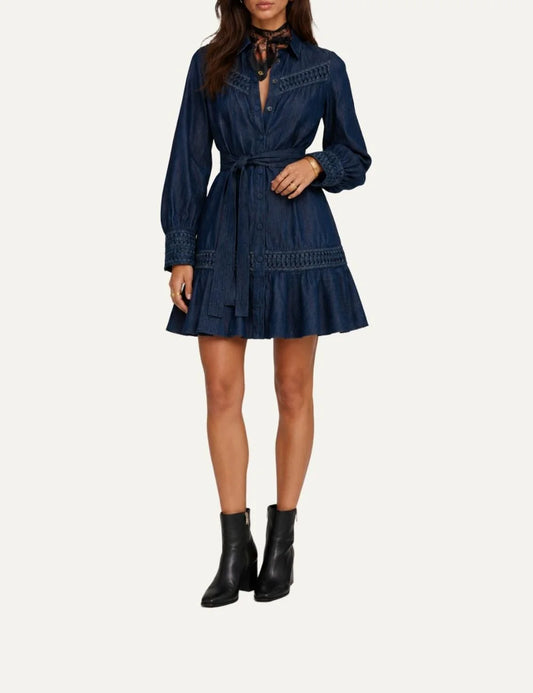 Scarlet Poppies women's Dala dark blue denim mini shirt dress with origami-inspired detailing, long puff sleeves, button-front closure, detachable waist belt and ruffled hem.