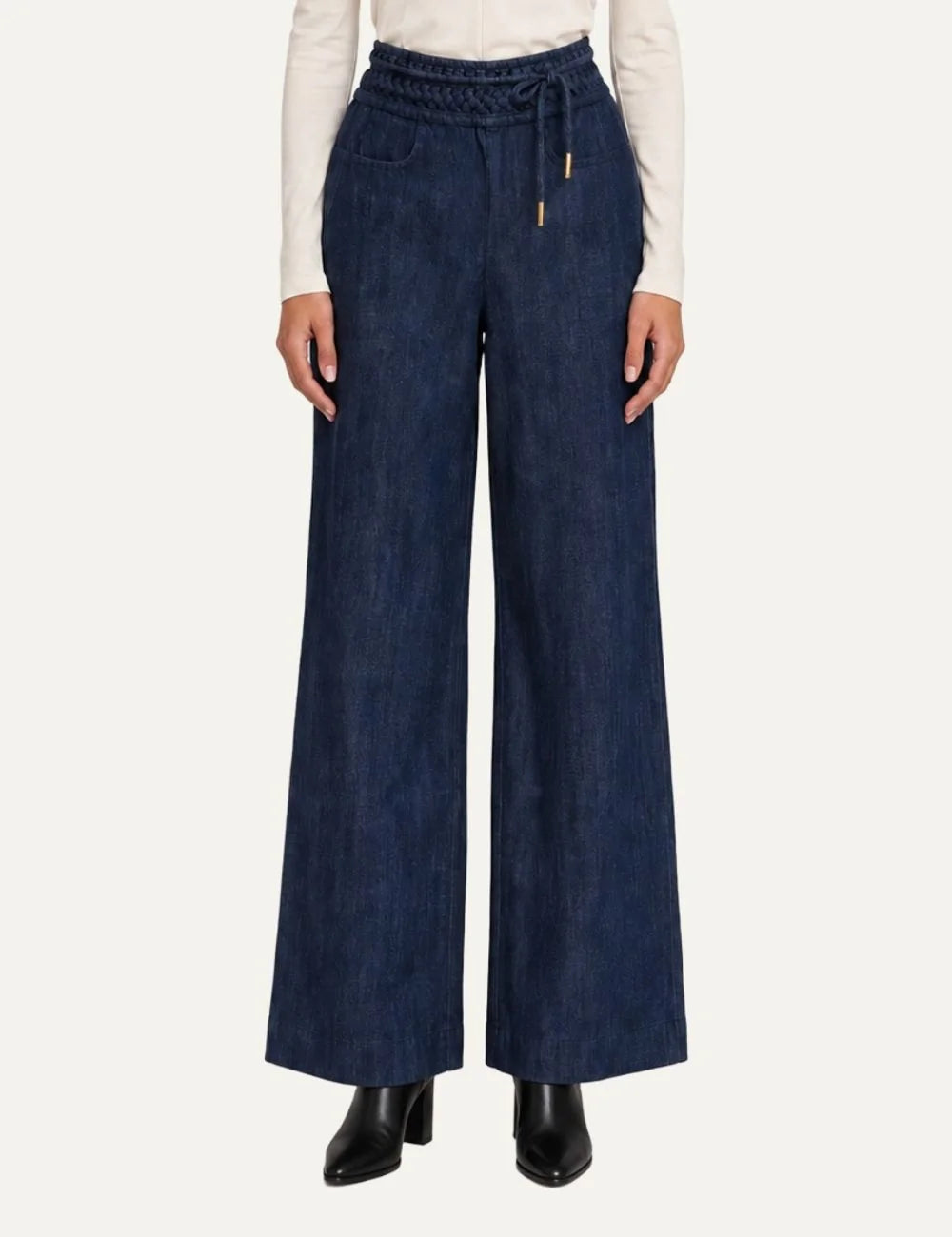 Scarlet Poppies women's Wayne dark blue denim trousers featuring wide straight legs, origami-inspired textured waistband, adjustable drawstring with gold-tone tips and side pockets.