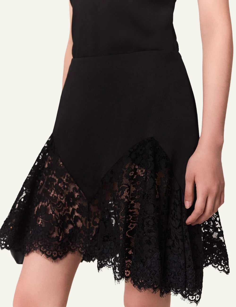 Stella McCartney black satin mini skirt with floral lace trim side