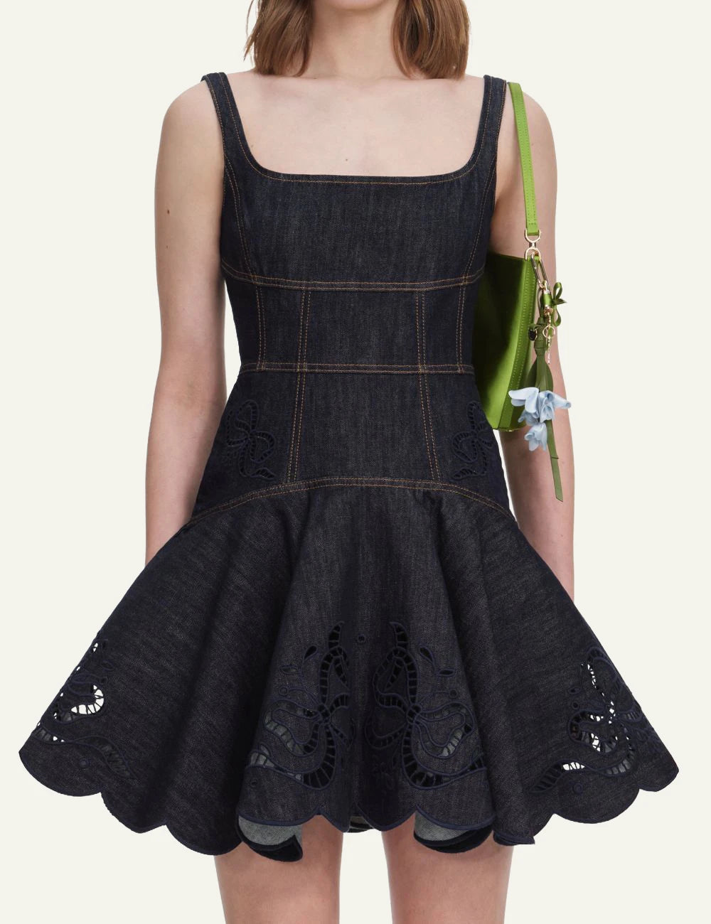 Self-Portrait denim mini dress with embroidered bow details and flared skirt model