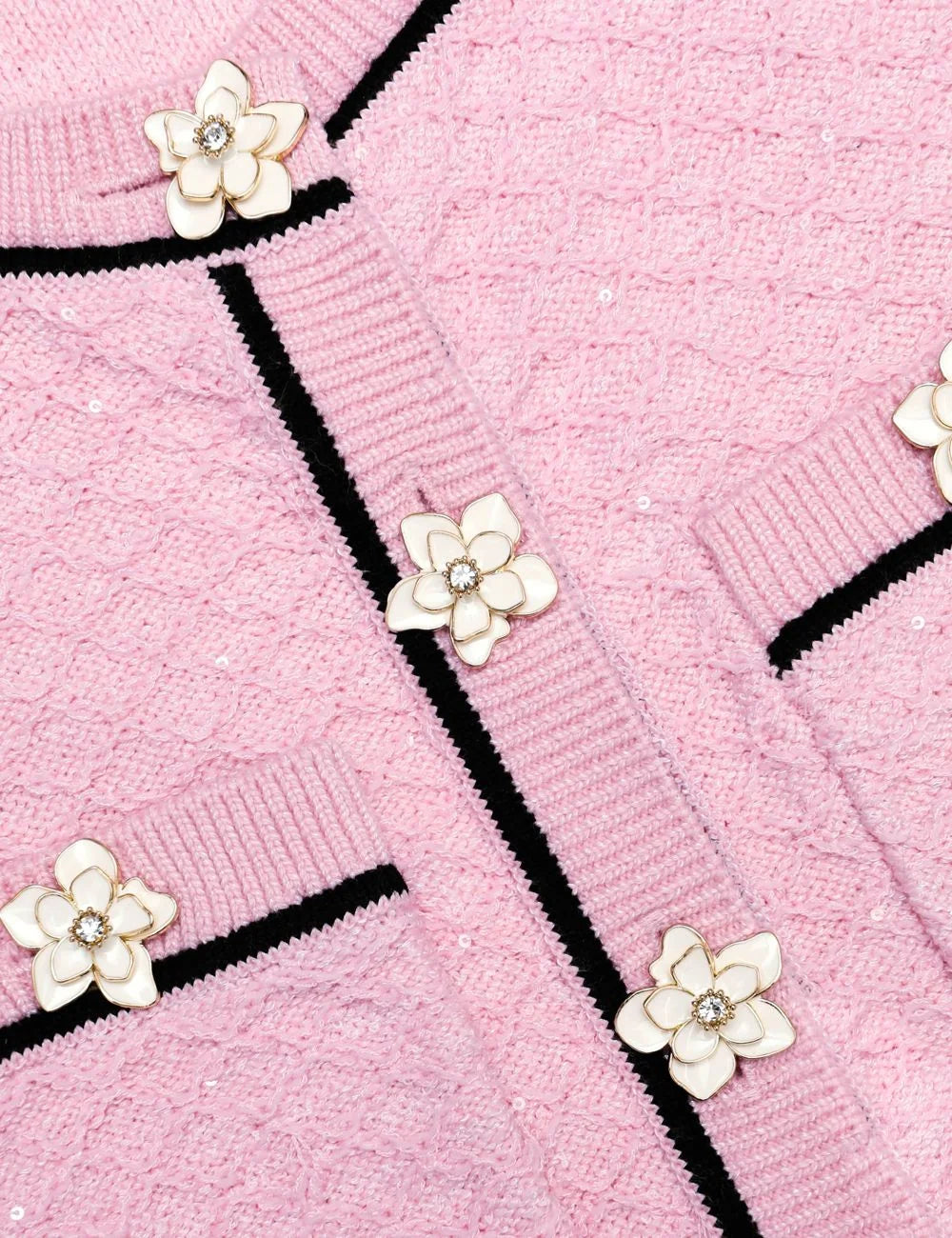Pink cropped knit top with floral buttons and contrast trim by Self-Portrait detail