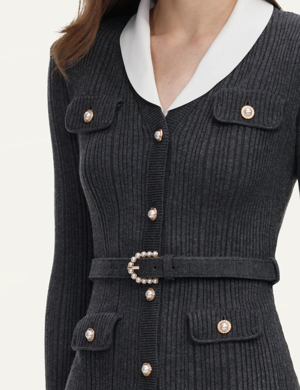 Pink cropped knit top with floral buttons and contrast trim by Self-Portrait model