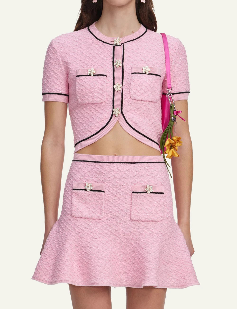 Pink textured mini skirt with contrast trim, floral buttons and flared hem by Self-Portrait