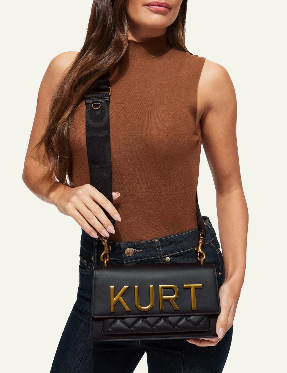 Kurt Geiger Shoreditch East West black leather bag worn crossbody on model