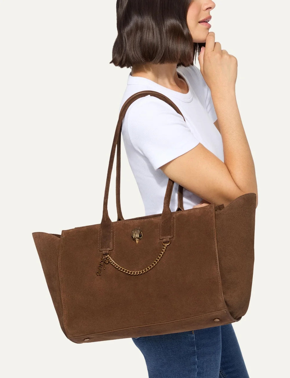 Kurt Geiger women's brown suede shopper tote bag with long shoulder handles, antique gold eagle head and decorative chain detail model