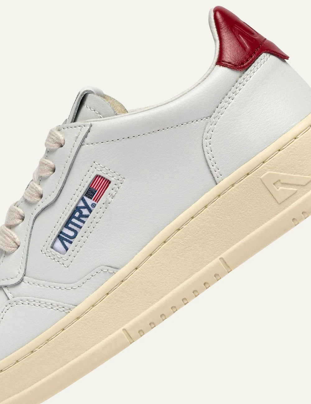 Women's Autry Medalist white leather sneakers with red heel tab and rubber detail