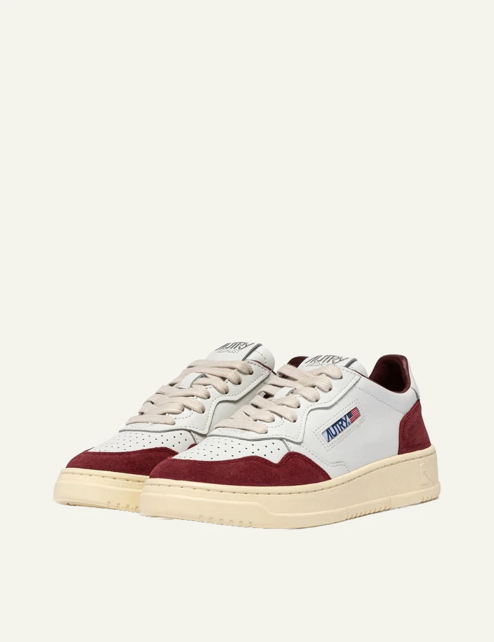 Autry women’s white leather sneakers with burgundy suede details profile
