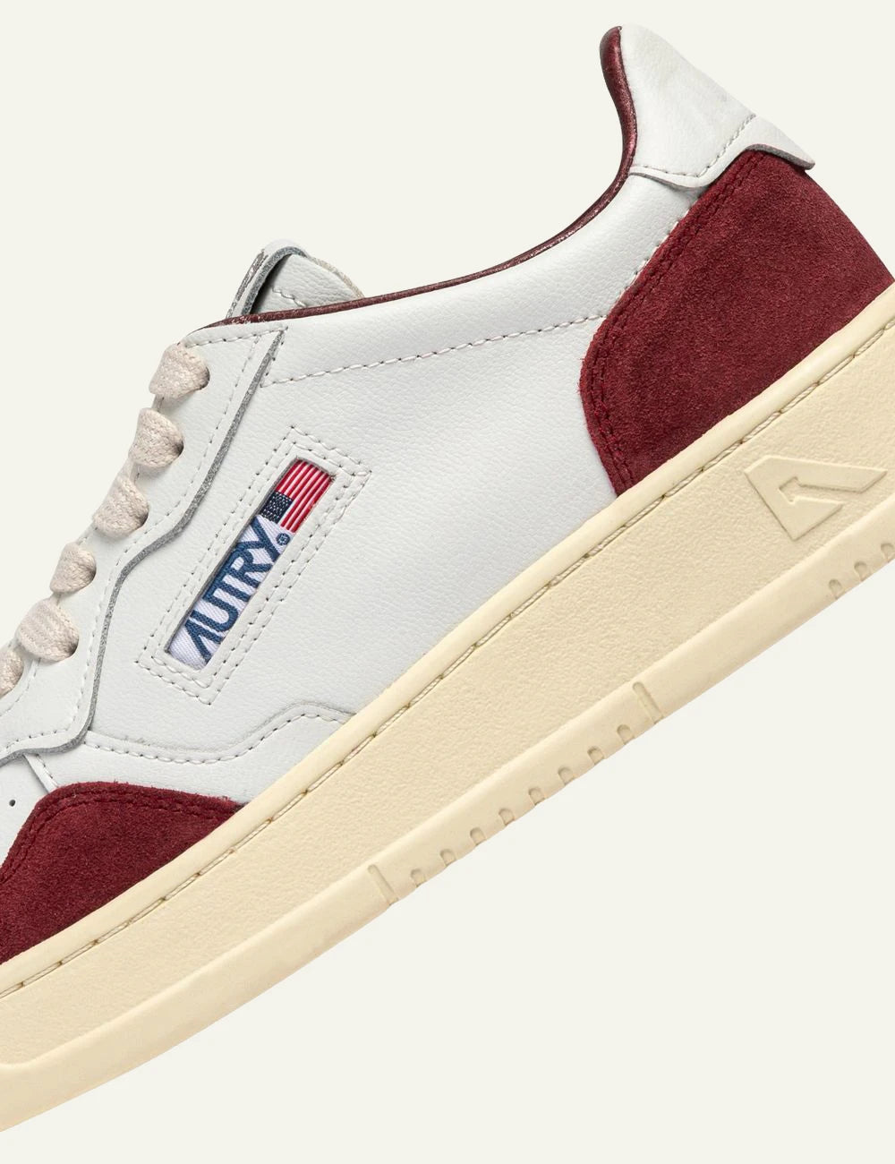 Autry women’s white leather sneakers with burgundy suede details logo