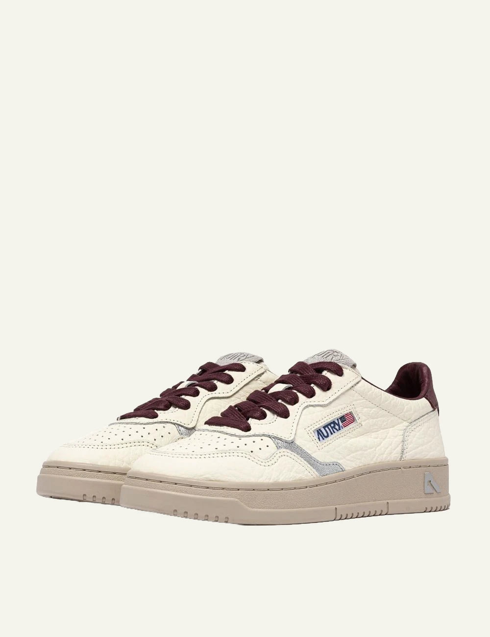 Autry women’s ivory grained leather sneakers with burgundy and silver details profile