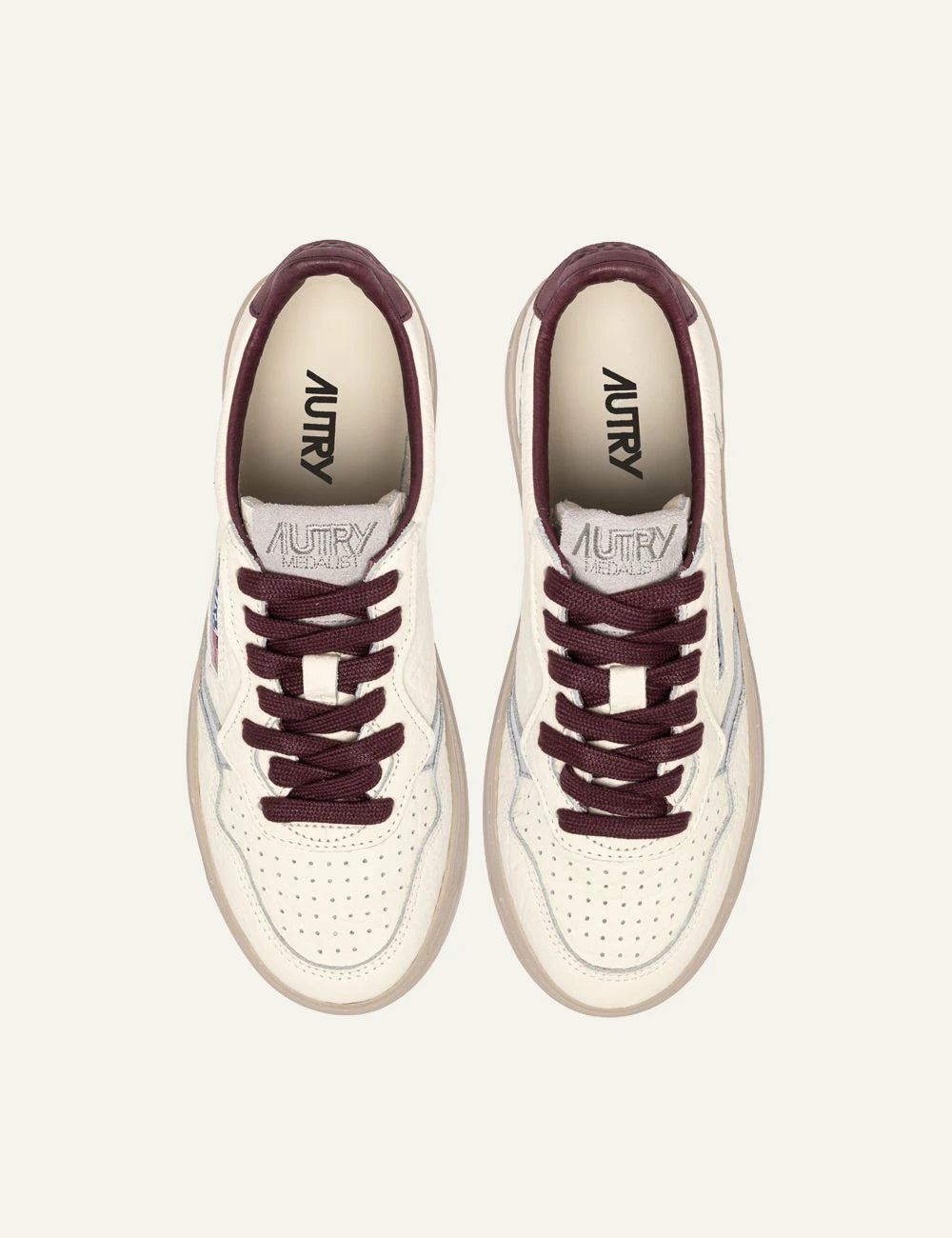 Autry women’s ivory grained leather sneakers with burgundy and silver details top