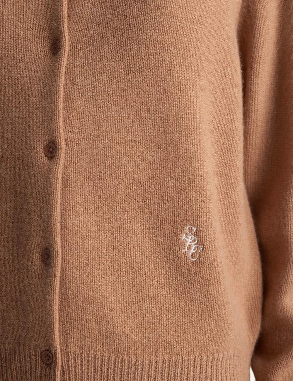 Sporty and Rich camel cashmere cardigan embroidered logo front detail view