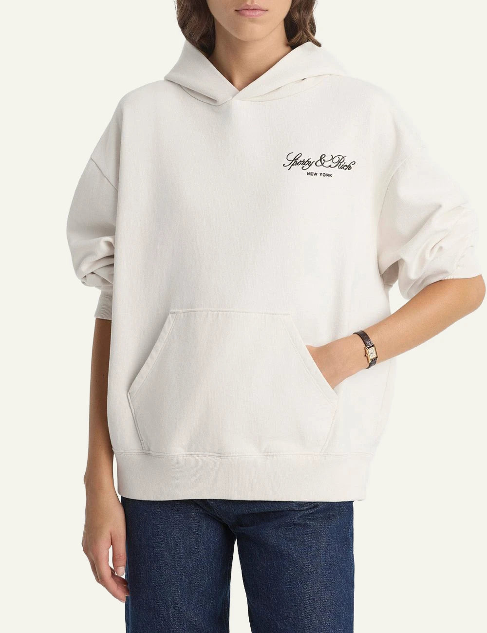 Sporty and Rich ecru hoodie embroidered logo front model view
