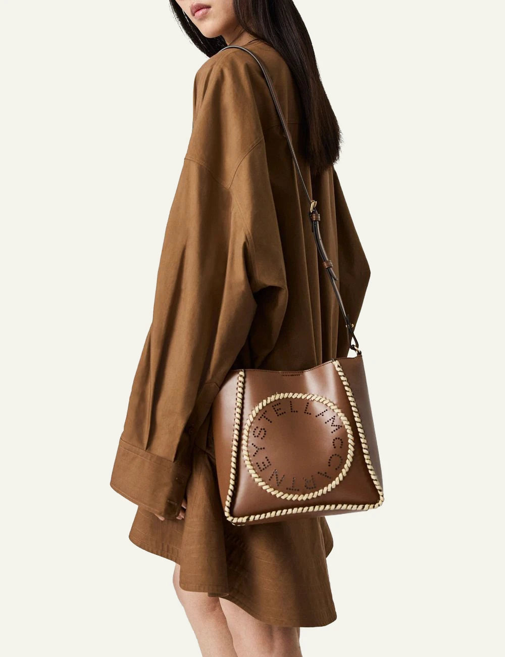 Stella McCartney crossbody bag tan me logo raffia detail front model view