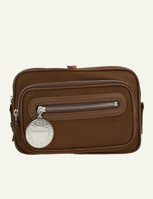Stella McCartney camera bag in brown vegan leather with front zip pocket and logo coin charm, front view
