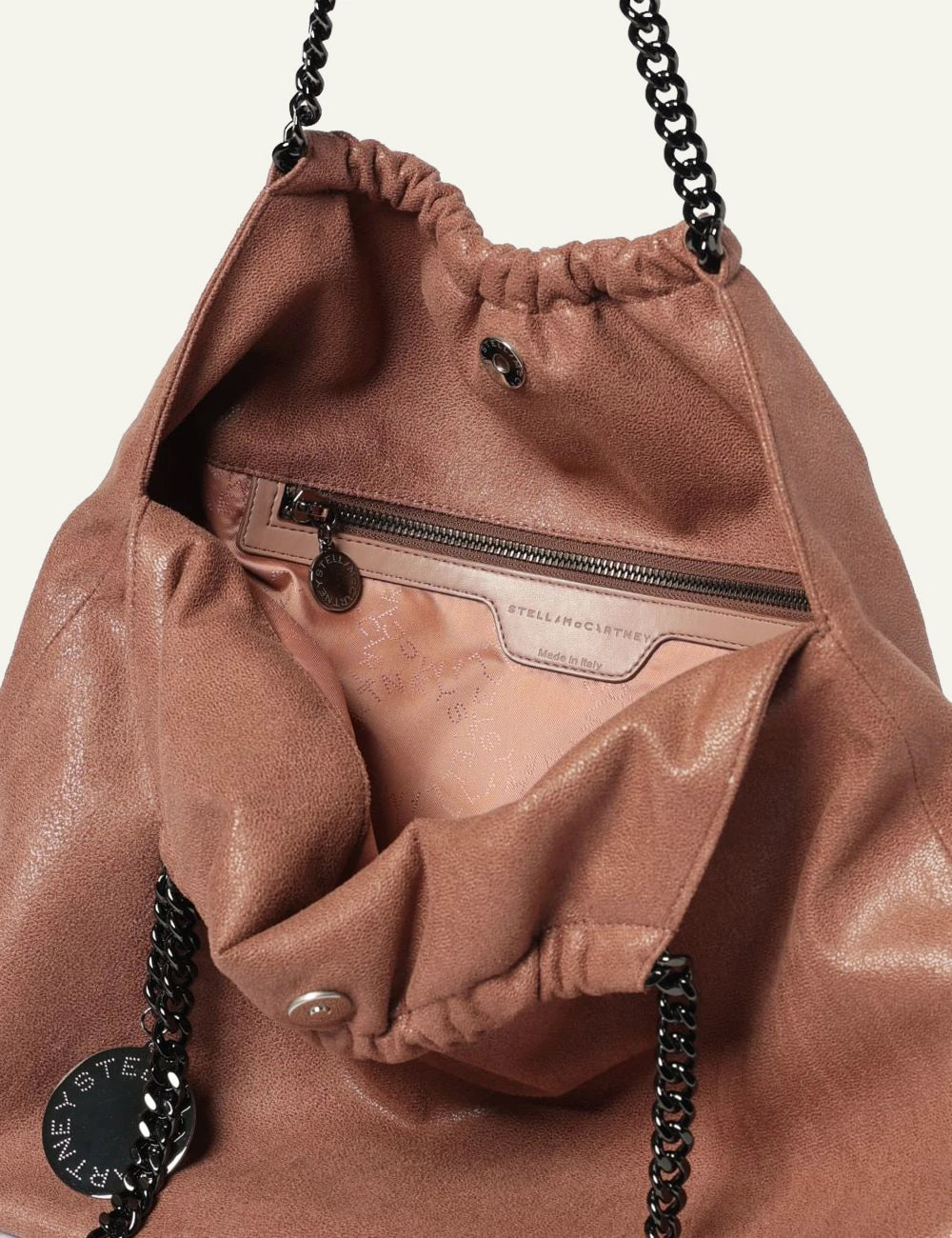 Stella McCartney Falabella clutch bag in dusty pink vegan leather with chain shoulder strap and logo charm, top view