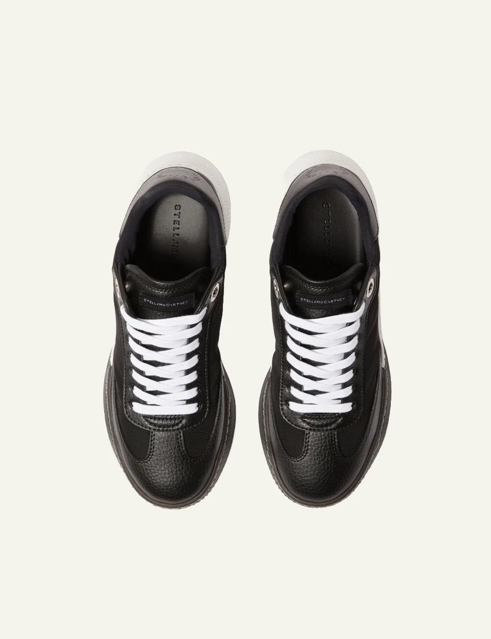 Stella McCartney platform sneaker in black with white laces and chunky white sole, top view