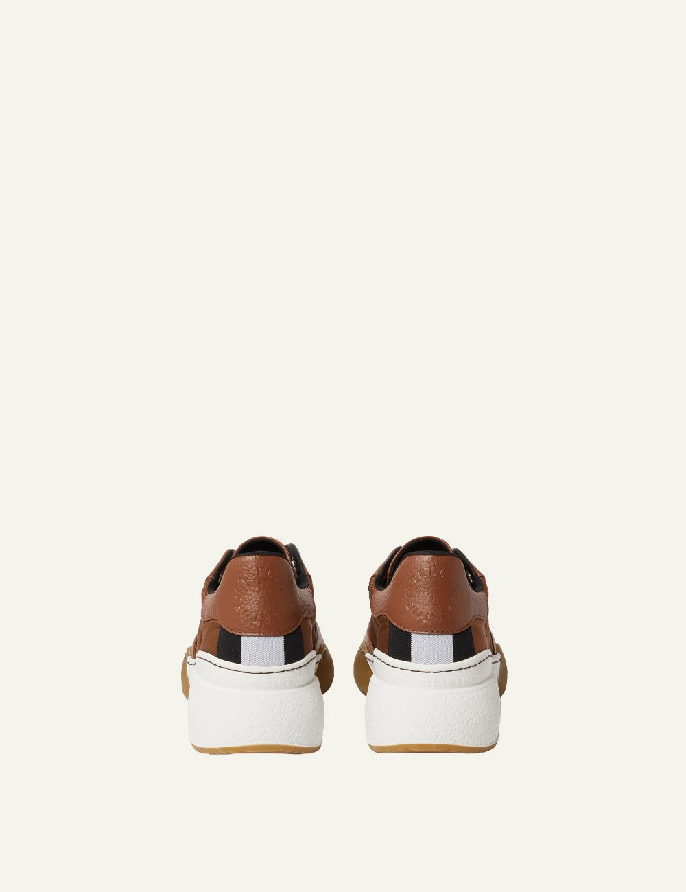Stella McCartney platform sneaker in brown with white laces and chunky white sole, back view