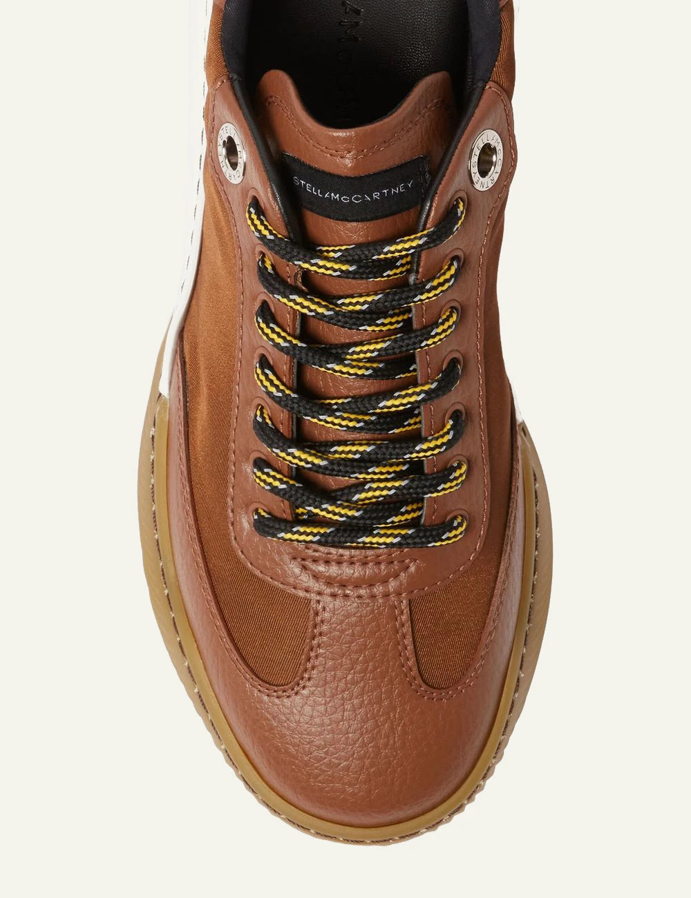 Stella McCartney platform sneaker in brown with white laces and chunky white sole, top detail view