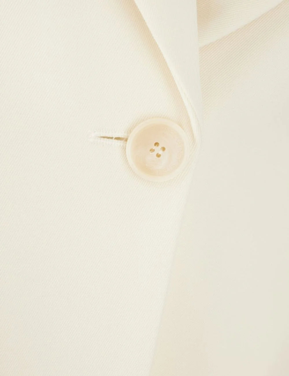 Stella McCartney tailored blazer in ivory with single button closure and peak lapels, detail view