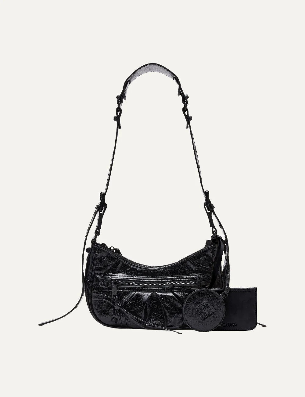 Steve Madden Bglowing women's black glossy textured shoulder bag with curved silhouette, front zipper pocket, long adjustable strap, removable zip pouch and round mirror charm, front view.