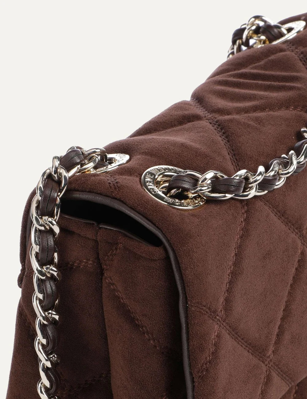 Steve Madden BVOLT-S women's dark brown quilted suede effect shoulder bag with diamond stitching, silver tone metal logo, flap closure and interwoven chain shoulder strap, close up details