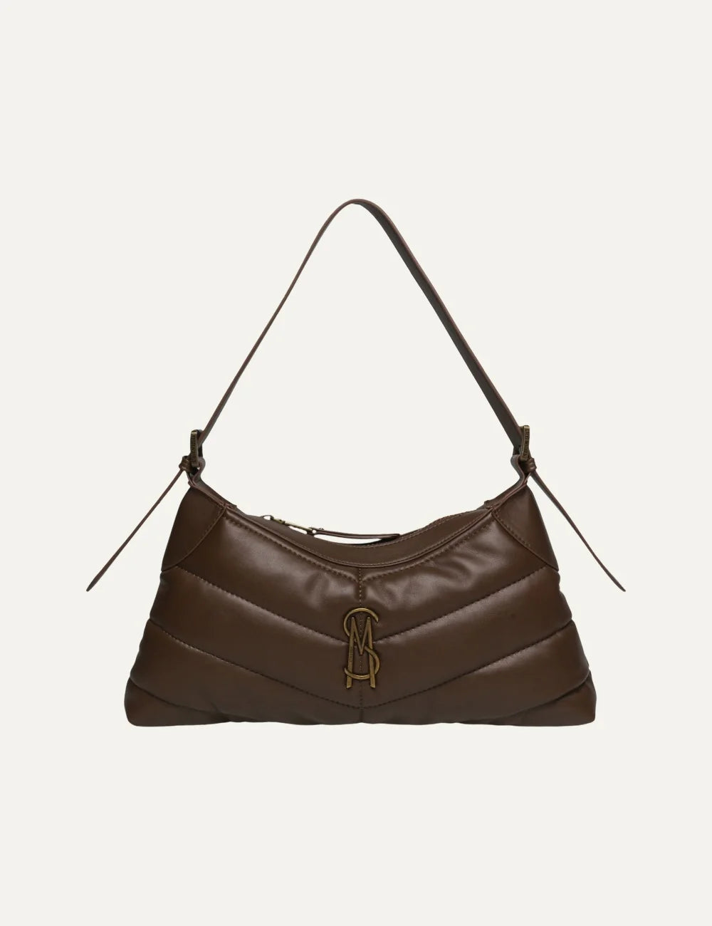 Steve Madden women's chocolate brown quilted shoulder bag with horizontal padded stitching, curved silhouette, slim shoulder strap, antique gold tone SM logo and top zip closure, front view.