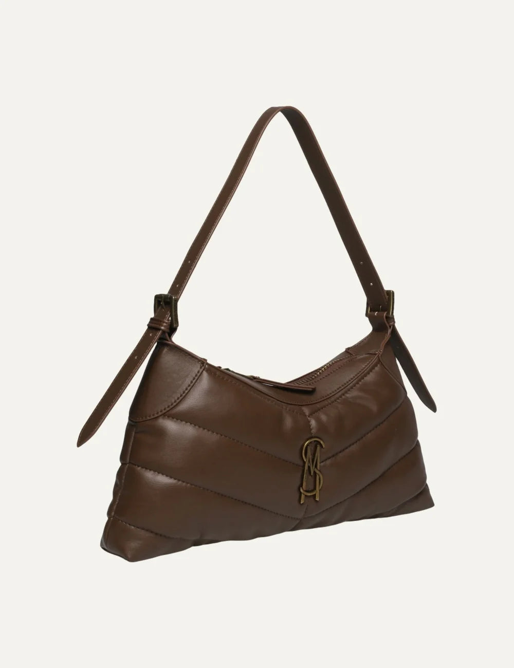 Steve Madden women's chocolate brown quilted shoulder bag with horizontal padded stitching, curved silhouette, slim shoulder strap, antique gold tone SM logo and top zip closure,  side view